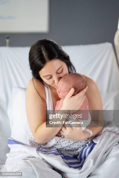 welcoming new life! - nurse ppe baby stock pictures, royalty-free photos & images