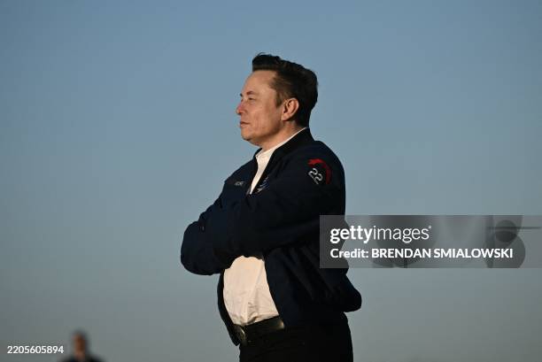 Elon Musk steps off Air Force One upon arrival at Morristown Municipal Airport in Morristown, New Jersey, on March 22, 2025. US President Donald...