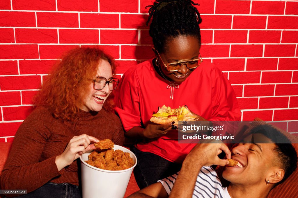 Friends Enjoying Fast Food Together