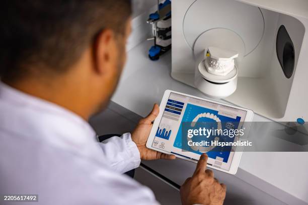 health engineer making a 3d dental mold and using a digital tablet - dental mould stock pictures, royalty-free photos & images