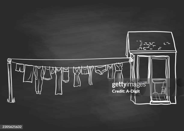 clothesdryingonthelineblackboard - pyjamas stock illustrations