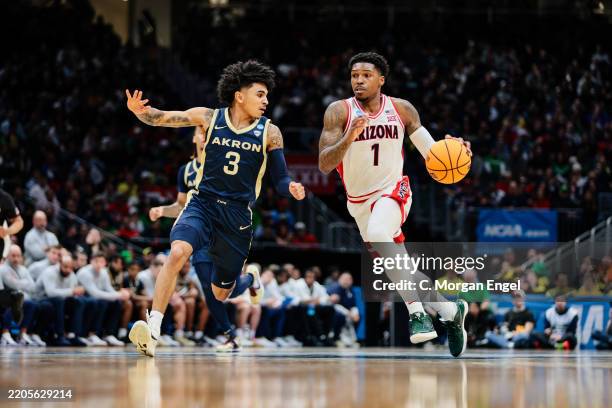 Caleb Love of the Arizona Wildcats dribbles the ball during the second half of the game against the Akron Zips in the first round of the 2025 NCAA...
