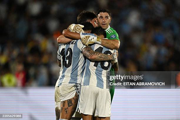 Argentina's defender Nicolas Otamendi, defender Leonardo Balerdi, defender Nahuel Molina and goalkeeper Emiliano Martinez celebrate after winning the...