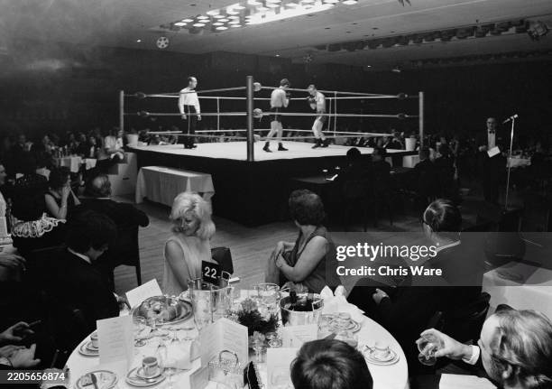 British boxing promoter and publican Beryl Cameron Gibbons sitting at a table at a 'boxing dinner night' at the Royal Garden Hotel in Kensington,...