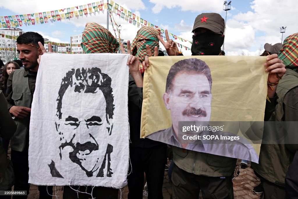 A demonstrator holds a poster of Abdullah Ocalan, the leader...