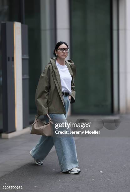 Maria Barteczko seen wearing Victoria Beckham black oversized aviator eyewear glasses, COS white basic cotton shirt, g-lab olive green hooded...