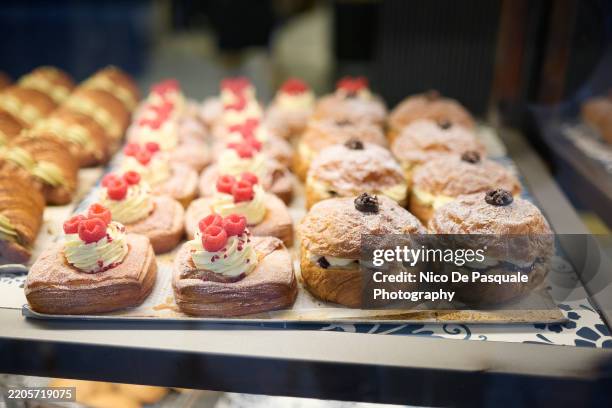 bakery display with assorted pastries - bakery items stock pictures, royalty-free photos & images