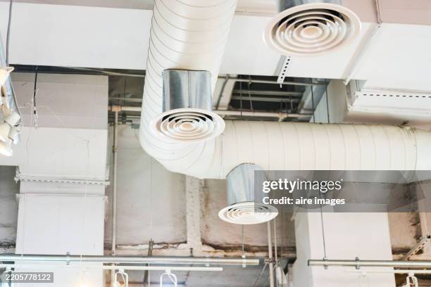 ventilation system with air ducts and diffusers providing cooling and heating - air duct stock pictures, royalty-free photos & images