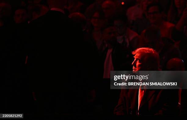 President Donald Trump attends the men's NCAA wrestling competition at the Wells Fargo Center in Philadelphia, Pennsylvania, on March 22, 2025.