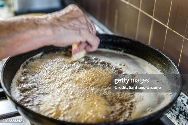 frying monkfish fish on a frying pan - sartén fotografías e imágenes de stock