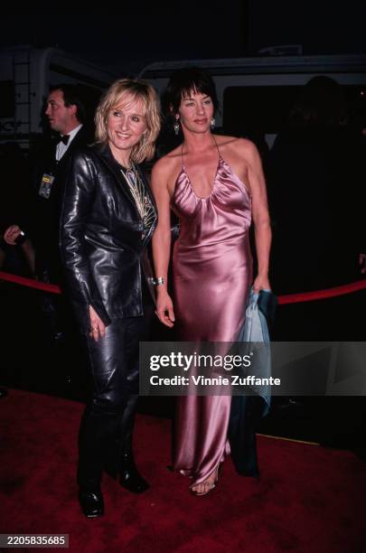 American singer and songwriter Melissa Etheridge and partner, American film director Julie Cypher, attend the 27th Annual American Music Awards at...