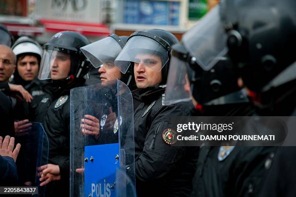 Turkish Football Riots Turkish riot police stand on the way of protesters as people take to ...
