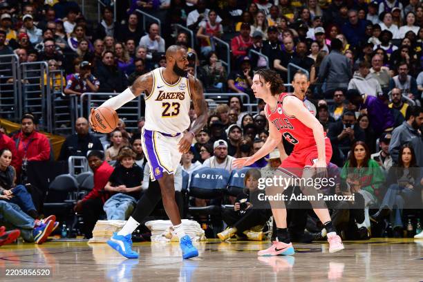 LeBron James of the Los Angeles Lakers dribbles the ball during the game against the Chicago Bulls on March 22, 2025 at Crypto.Com Arena in Los...