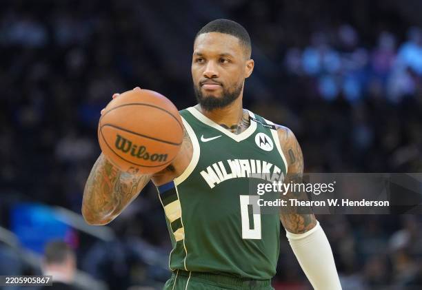 Damian Lillard of the Milwaukee Bucks looks on against the Golden State Warriors during the second half of an NBA basketball game at Chase Center on...