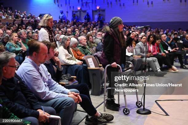 People ask questions as U.S. Representative Paul Tonko holds a town hall meeting at Schenectady High School to listen to his constituents' concerns...