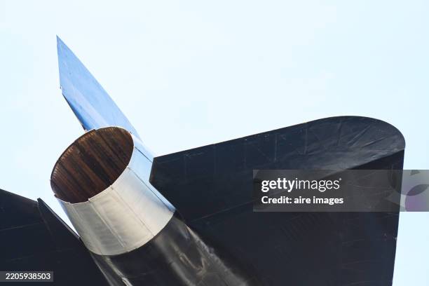 exhaust nozzle and tail of a supersonic jet engine pointing skyward - rocket engine stock pictures, royalty-free photos & images