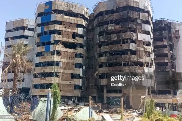 The heavily-damaged building that housed the headquarters of the Central Bank of Sudan is pictured in Khartoum's Muqrin neighbourhood on March 22,...