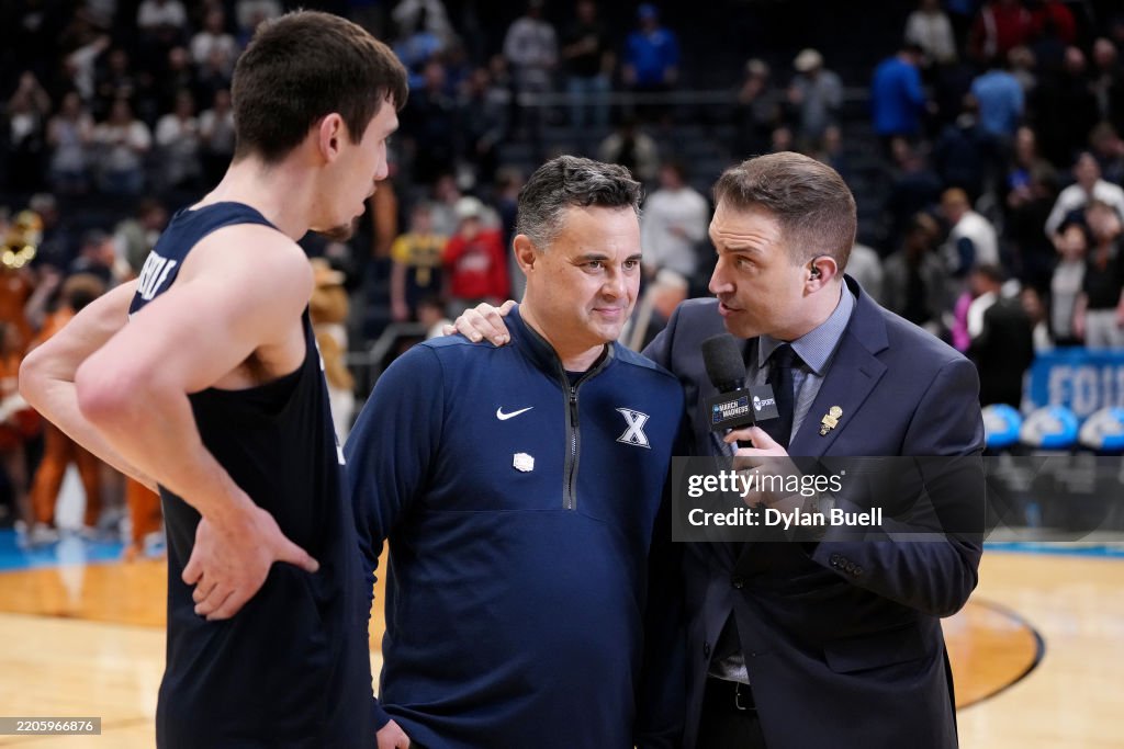 Head Coach Sean Miller and Zach Freemantle of the Xavier Musketeers ...