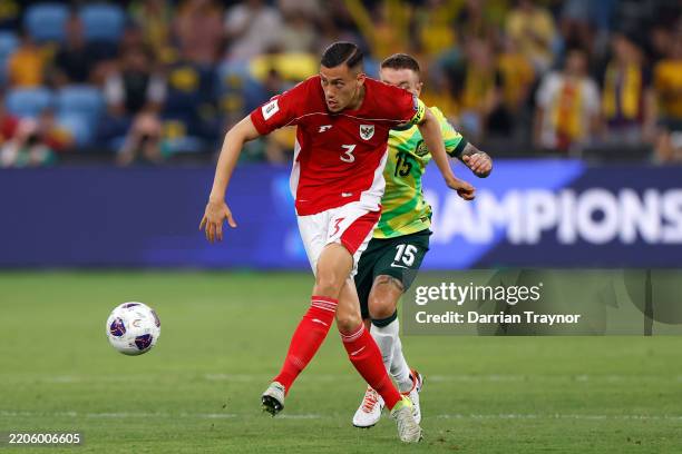 Jay Noah Idzes of Indonesia kicks the ball during the round three FIFA 2026 World Cup AFC Asian Qualifier match between Australia Socceroos and...