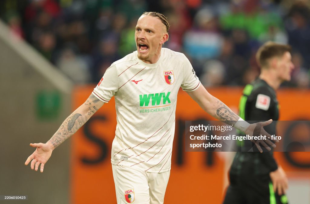 Mwolf Marius Wolf of FC Augsburg gestures during the Bundesliga match... News ...