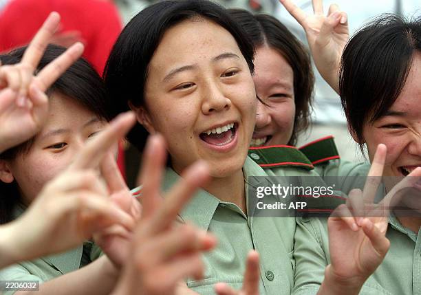 Chinese People's Liberation Army nurses celebrate after the last batch of SARS patients was discharged from the Xiaotangshan SARS hospital in the...