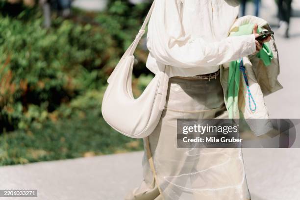 Guest is seen wearing a white top, white skirt, white bag during Rakuten Tokyo Fashion Week A/W 2025 on March 20, 2025 in Tokyo, Japan.