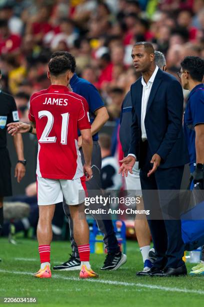 Indonesia head coach Patrick Kluivert talks to Dean James of Indonesia during the round three FIFA 2026 World Cup AFC Asian Qualifier match between...
