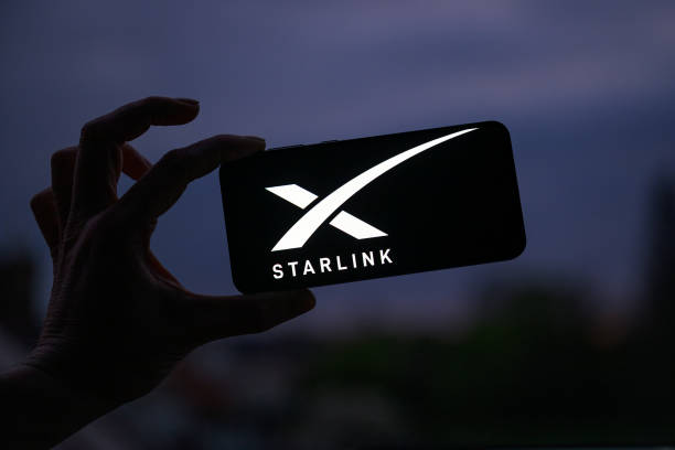 The SpaceX Starlink logo is displayed on a mobile phone in this photo illustration in Brussels, Belgium, on March 23, 2025.