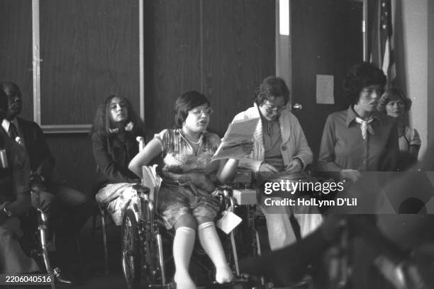 Disability rights activist Judy Heumann reads from a document at a press conference during the 'Section 504' sit-in at the Federal Office Building,...