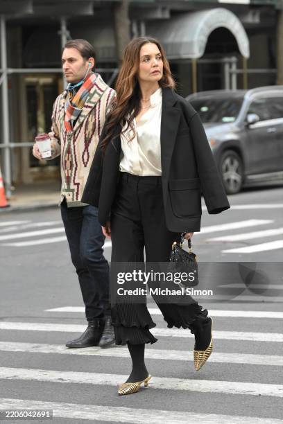 Katie Holmes is seen coming out of the subway in Franco Sarto kitten heel mules in gold While In New York City on March 20, 2025 in New York City.