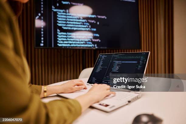 computer programmer writing code on a laptop in the office - web design stock pictures, royalty-free photos & images