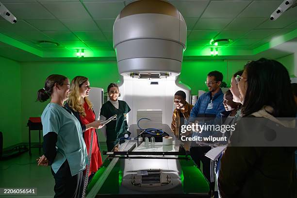 Medical Physicist Students Studying Advanced Oncology Equipment Linear ...