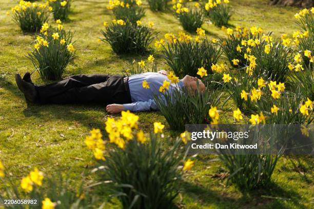 People enjoy the sunshine in St James's Park on March 20, 2025 in London, England. The astronomical spring season begins on the date of the spring...
