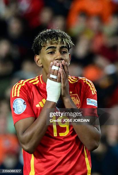 Spain's forward Lamine Yamal reacts to failing to score during the penalty shoot outduring the UEFA Nations League quarter final second leg football...