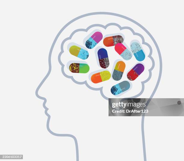 head with brain filled with pills concept - addiction concept stock illustrations