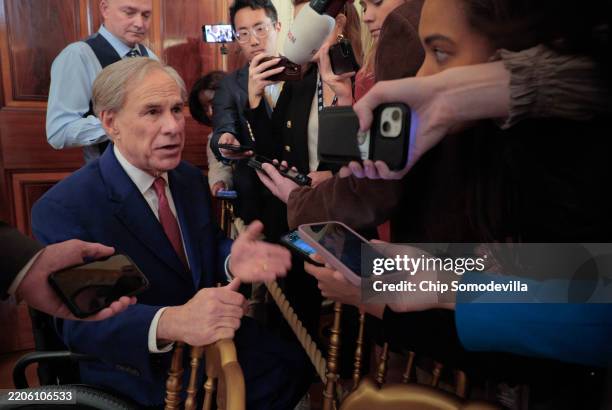 Texas Governor Greg Abbott talks to reporters after U.S. President Donald Trump signed an executive order to reduce the size and scope of the...