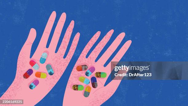 hands holding pills - entzündungshemmend stock-grafiken, -clipart, -cartoons und -symbole