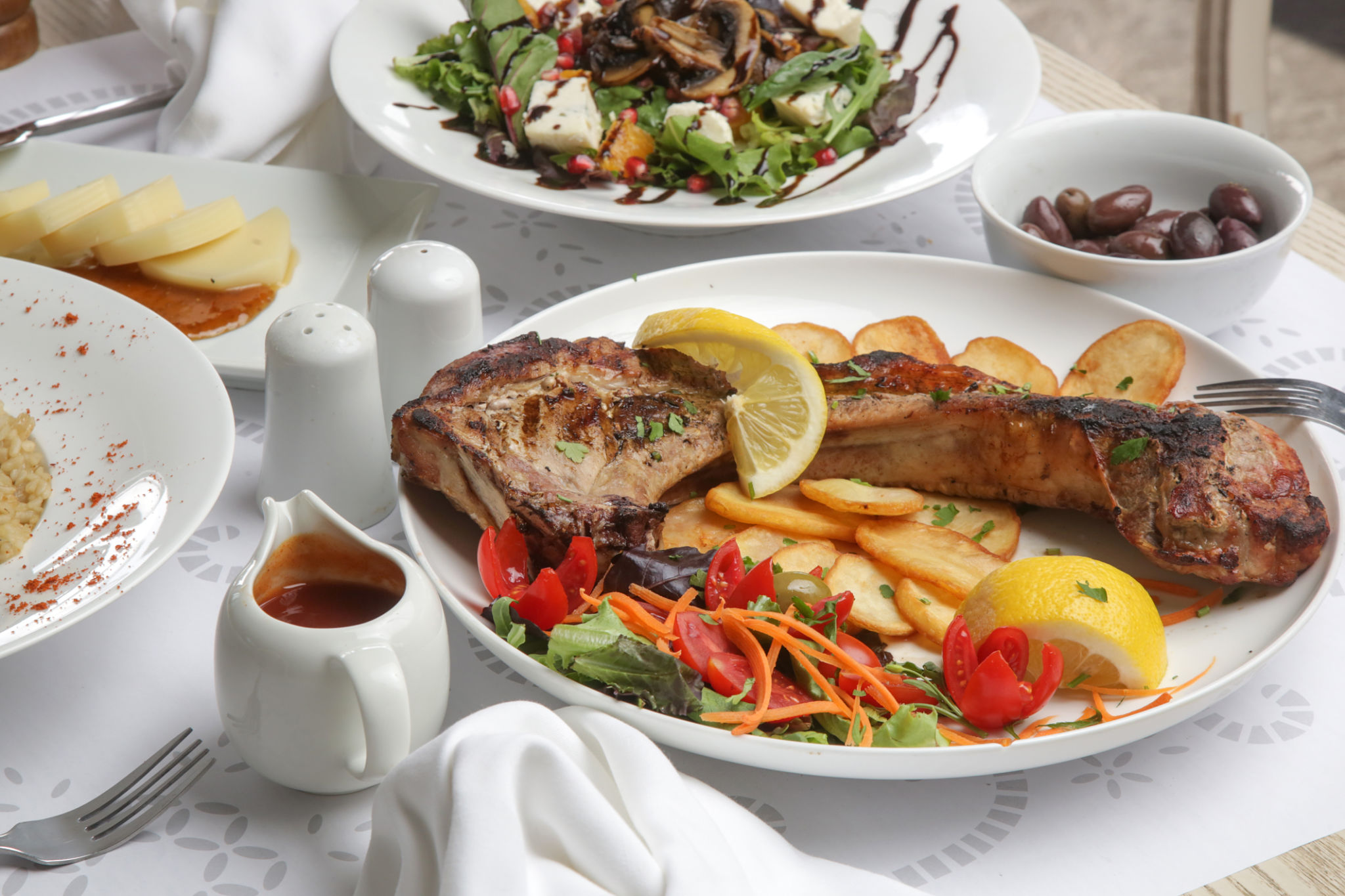 Various Mediterranean dishes served on the restaurant table Various Mediterranean dishes served on the restaurant table