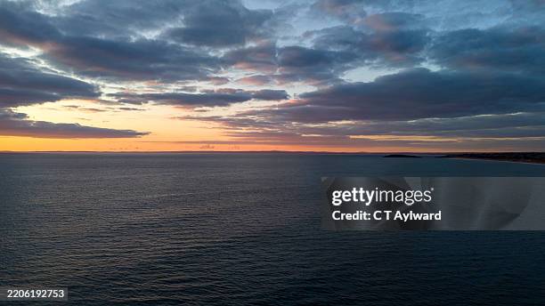 rhossili bay & worms head gower sunset - west glamorgan stock pictures, royalty-free photos & images