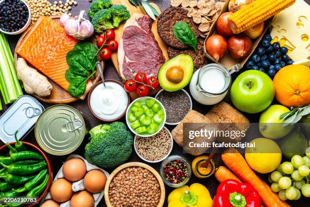 large group of raw food for a well balanced diet. includes carbohydrates, proteins and dietary fiber - carbohidrato fotografías e imágenes de stock
