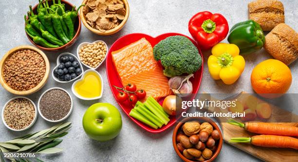group of healthy ingredients for strong and healthy heart - colesterol imagens e fotografias de stock