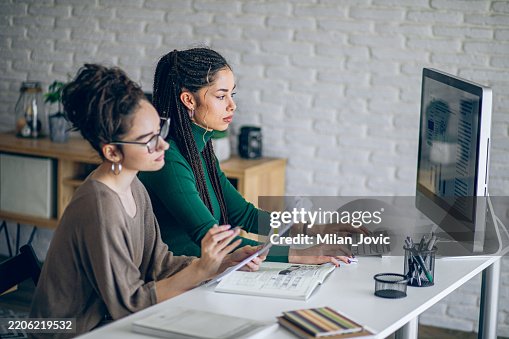 Two Young Women Studying Together Two College Students Doing Homework ...