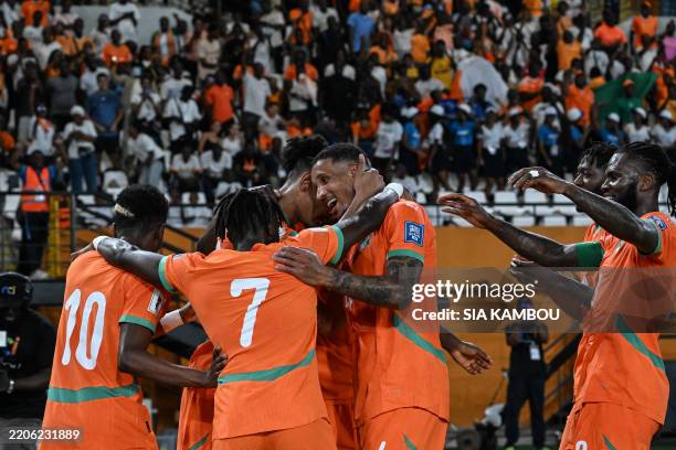 Ivory Coast players celebrate after unseen Ivory Coast's Sebastien Haller scored his team's first goal during the FIFA World Cup 2026 Africa...