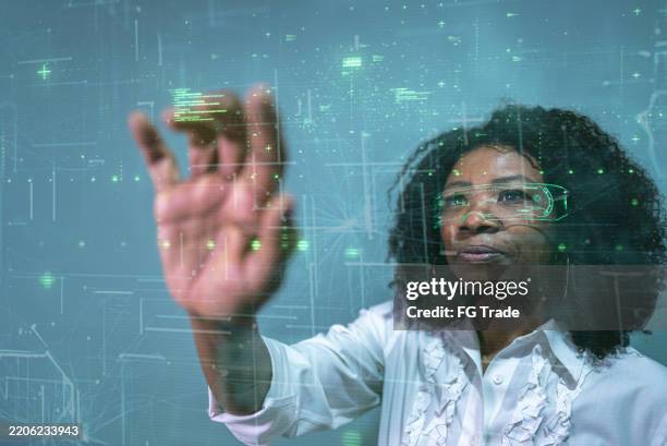 futuristic technology interface: woman interacting with virtual data stream - user experience testing stock pictures, royalty-free photos & images