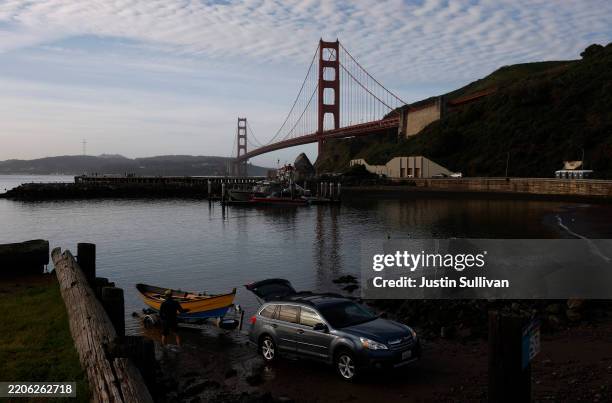 Boater launches his boat into the San Francisco Bay by the Golden Gate Bridge on March 21, 2025 in Sausalito, California. According to a new report...