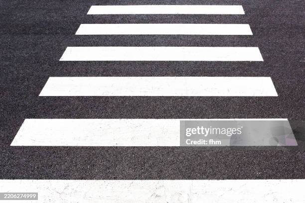 zebra crossing on a street - road marking stock pictures, royalty-free photos & images