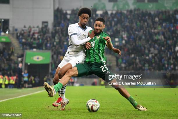 Alvyn Sanches of Switzerland is challenged by Brodie Spencer of Northern Ireland during the International Friendly match between Northern Ireland and...