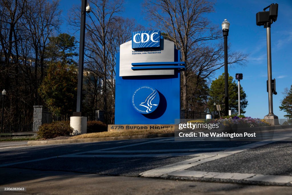 Supporoters and former employees of the Centers for Disease Control and Prevention rally outside of the CDC Chamblee campus