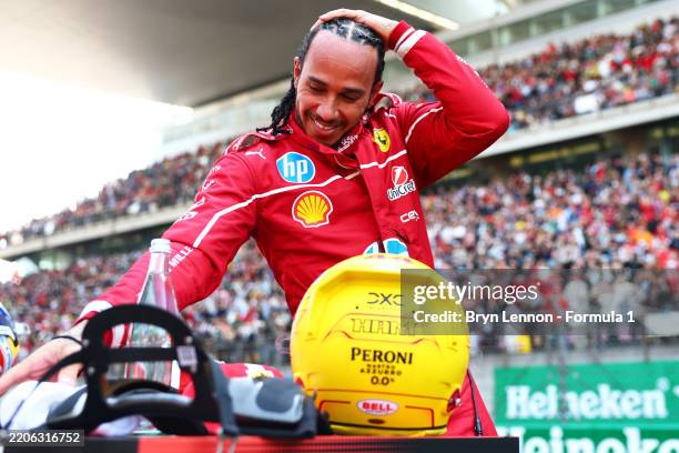 Sprint winner Lewis Hamilton of Great Britain and Scuderia Ferrari celebrates in parc ferme during the Sprint ahead of the F1 Grand Prix of China at...