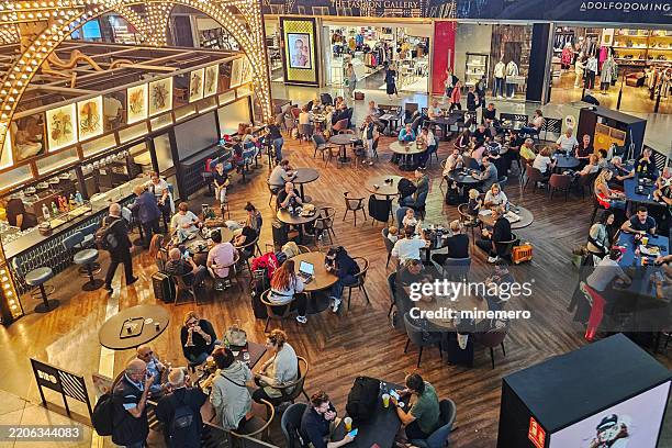 top view of a cafe in málaga airport - busy stock pictures, royalty-free photos & images